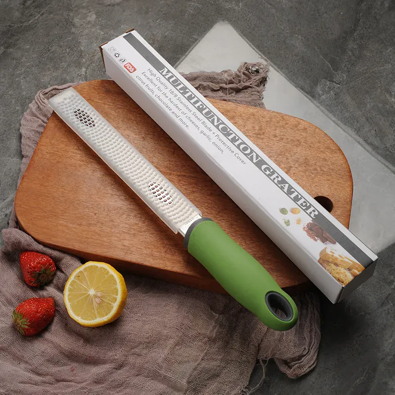 Zesteur en Inox pour Fruits et Fromage - 4 Lames Poignée Antidérapante