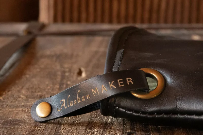 Manique Alaskan Maker Defender noir et orange en cuir