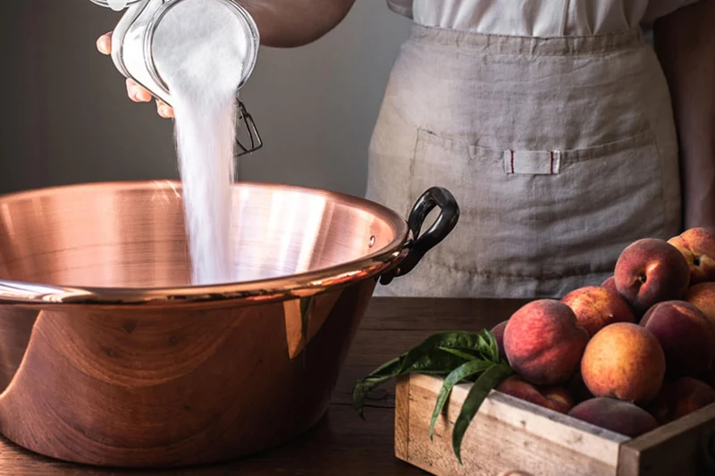 Bassine à confiture De Buyer en cuivre lisse et anses en fonte