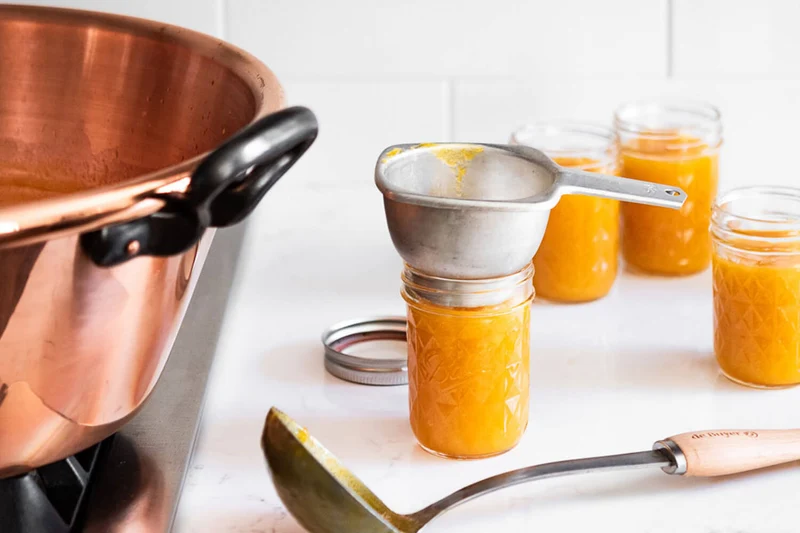Bassine à confiture De Buyer en cuivre lisse et anses en fonte
