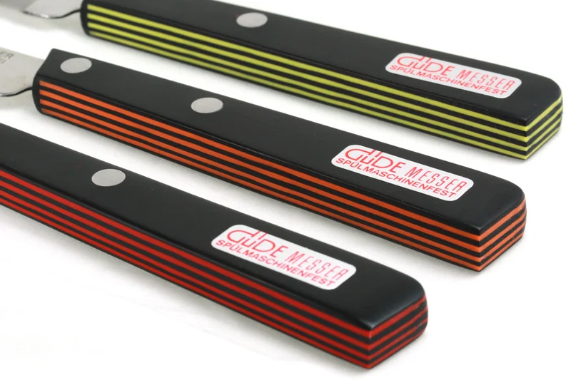 Couteau de table GÜDE Universel 10cm micro-denté manche noir/rouge