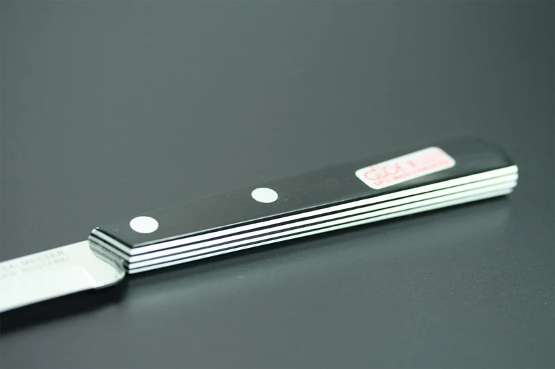 Couteau de table GÜDE Universel 10cm micro-denté manche noir/blanc